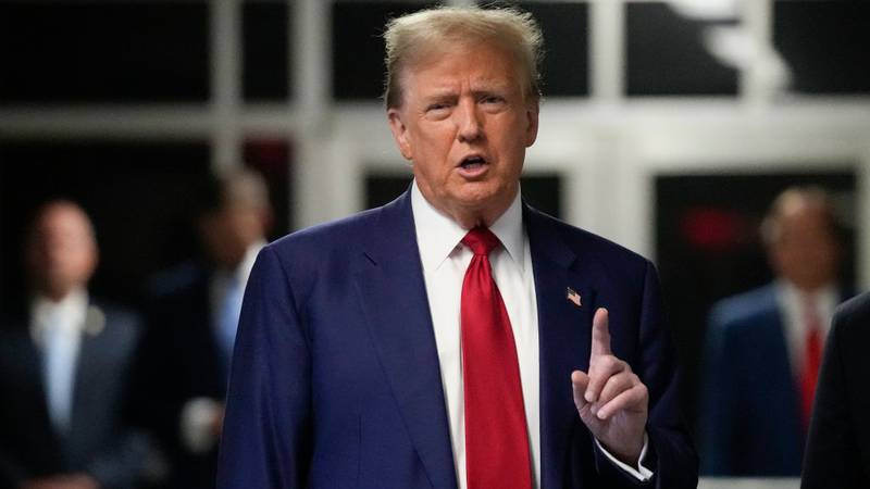 Former President Donald Trump speaks outside the courthouse where he is currently on trial.