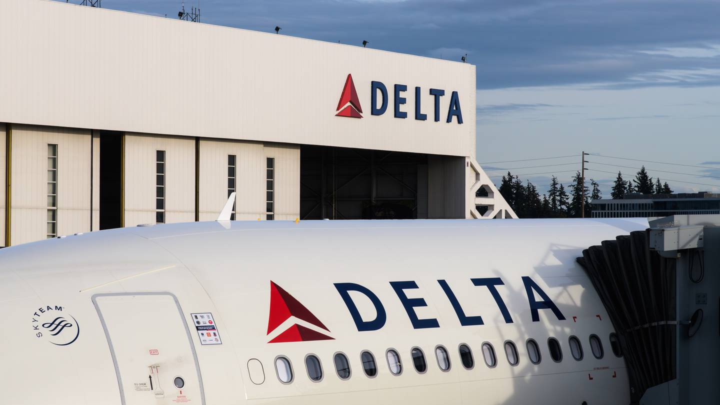 Delta plane in front of a hangar