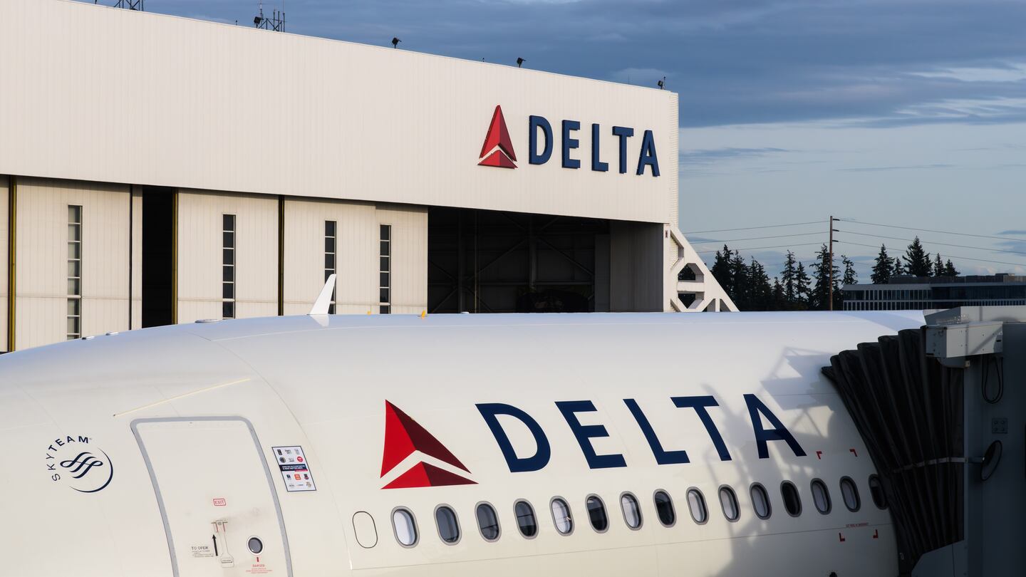Delta plane in front of a hangar